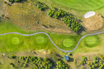 Aerial view of golf course. Drone or helicopter view of green field sand bunker