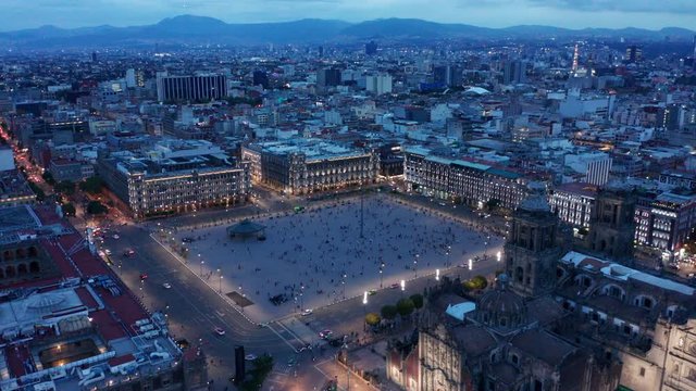 evening flying counter clockwise over cathedral around Mexico City Zocalo