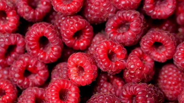 Close Up Rotation Loopable Raspberry. Fresh, Juicy Raspberry Background, Ripe. Macro Red Raspberries Fruit. Fresh Raspberry Fruits As Food Dackground. Healthy Food Organic Nutrition.