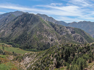 Naklejka premium Aerial view of Angeles National Forests mountain, California, USA. Green mountain during hot summer season