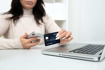 Internet shopping online. Woman with credit card using in to buy things