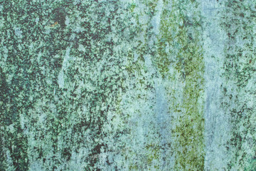 Green grunge painted wall surface worn weathered dirty old rough vintage background surface texture