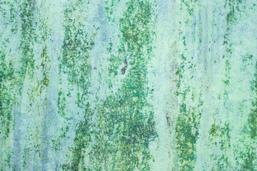 Fototapeta premium Green grunge painted wall surface worn weathered dirty old rough vintage background surface texture