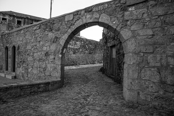 Fototapeta na wymiar Cobblestone, Stone Arch and Stone Walls, Braga, Portugal