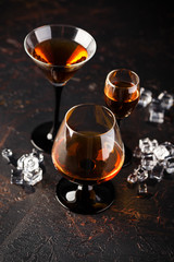 Set of strong alcoholic drinks in glasses
