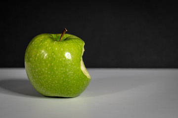 green Apple on black background