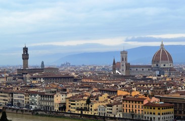 Fototapeta na wymiar View of Florence from the hill of Michelangelo on a cloudy day.