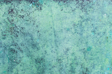 Green grunge painted wall surface worn weathered dirty old rough vintage background surface texture