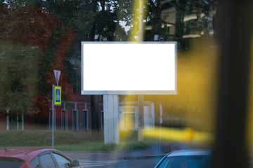 large billboard in the city mockup blurred foreground with yellow spots through the window