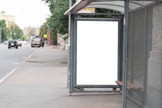 billboard at the bus stop outdoor ad.bus shelter with white field mockup advertisement in the afternoon.