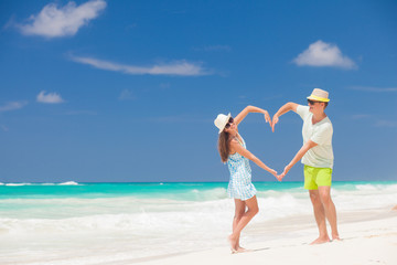 Beach couple walking on romantic travel honeymoon vacation summer holidays romance. Young happy lovers, Cayo LArgo, Cuba