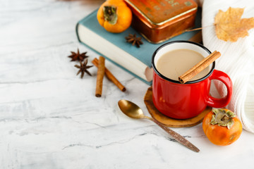 Autumn light still life with coffee and book