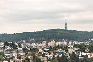 Obraz premium Bratislava 2019. Panorama of the city on a hill with a large TV tower. Private and apartment buildings in Bratislava.