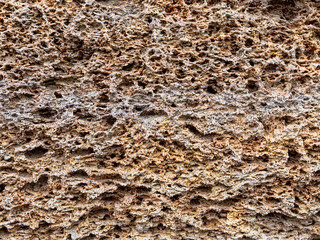 Texture. Limestone. Decorative rock. Porous surface. Background. Close-up.