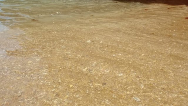 Stunning slow motion shot of the seashore of Dona Ana Beach in Lagos, The Algarve, Portugal