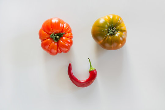 Ugly Ripe Tomatoes And Pepper As Face, Smile With Eyes.