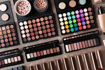 Set of different professional makeup products on table, flat lay
