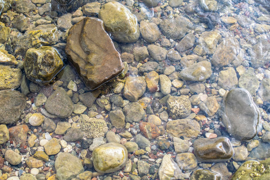 Wet stones in water. Stone background image.