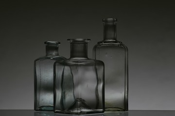 Glass bottles on white background in a studio