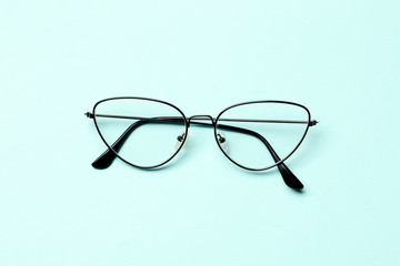 Glasses on a blue background with place for text.