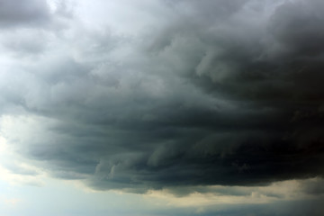 Sky with heavy rainy clouds on grey day