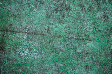 Green grunge painted wall surface worn weathered dirty old rough vintage background surface texture