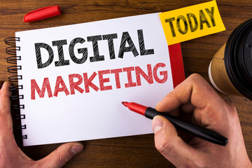 Conceptual hand writing showing Digital Marketing. Business photo text Strategy of products services digital technologies online written by Man Notepad holding Pen Wooden background Today Cup