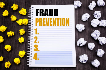 Conceptual hand writing text caption showing Fraud Prevention. Business concept for Crime Protection Written notepad note notebook book wooden background with sticky folded yellow and white