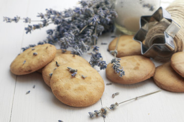 Tasty lavender cookies on light background
