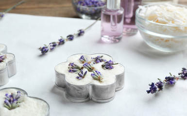 Obraz na płótnie Canvas Handmade soap bar with lavender flowers in metal form on white paper. Space for text