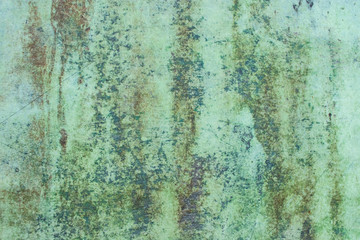 Green grunge painted wall surface worn weathered dirty old rough vintage background surface texture