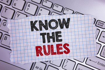 Text sign showing Know The Rules. Conceptual photo Understand terms and conditions get legal advice from lawyers written Tear Notebook paper placed the Laptop.