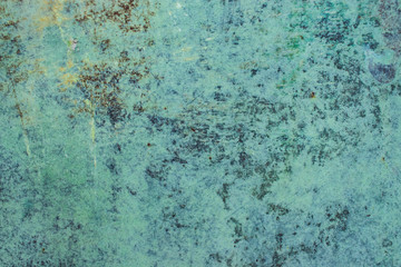 Green grunge painted wall surface worn weathered dirty old rough vintage background surface texture