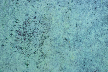 Fototapeta na wymiar Green grunge painted wall surface worn weathered dirty old rough vintage background surface texture