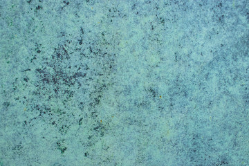 Green grunge painted wall surface worn weathered dirty old rough vintage background surface texture