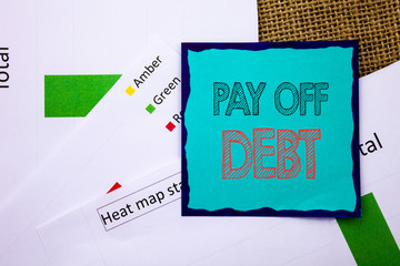Conceptual writing text showing Pay Off Debt. Concept meaning Reminder To Paying Owed Financial Credit Loan Bills written Sticky Note Paper the textured background. Heat Map Status