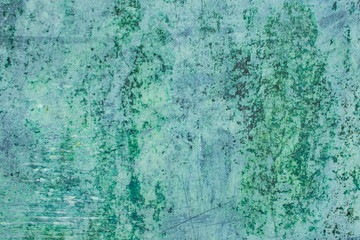 Fototapeta na wymiar Green grunge painted wall surface worn weathered dirty old rough vintage background surface texture
