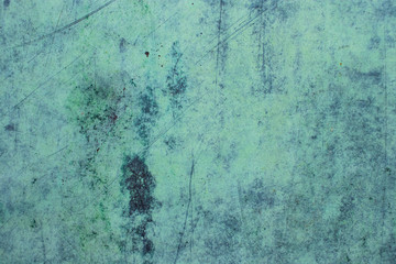 Green grunge painted wall surface worn weathered dirty old rough vintage background surface texture