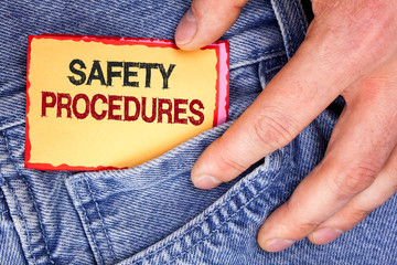 Word writing text Safety Procedures. Business concept for Follow rules and regulations for workplace security written Sticky Note Paper holding by man the Jeans background.