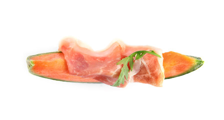 Slice of fresh melon with prosciutto and arugula on white background, top view