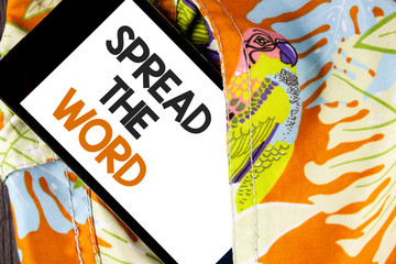 Conceptual hand writing showing Spread The Word. Business photo text Run advertisements to increase store sales many fold written Mobile Phone Screen the printed fabric background.