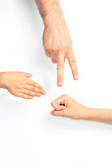 Family playing rock, paper and scissors on white background, closeup