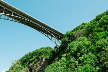 Fototapeta premium Road bridge over the gorge. Bottom view
