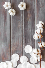 Hygiene and cosmetic with cotton pads on wooden background top view mock up