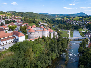 Fototapeta na wymiar The castle Žužemberk ( Zuzemberk, Seisenburg, Sosenberch) is positioned on the terrace above the Krka River Canyon, Central Slovenia.