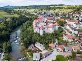 Obraz premium The castle Žužemberk ( Zuzemberk, Seisenburg, Sosenberch) is positioned on the terrace above the Krka River Canyon, Central Slovenia.