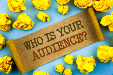 Naklejka premium Word, writing, text Who Is Your Audience Question. Business concept for Customer Target Service Client Research written tear paper with folded paper the background.