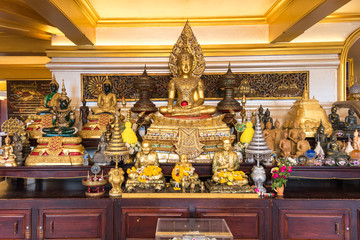 Shrine in the temple hall on top of the Golden Mount. The monastery Wat Saket is one of the major tourist attractions in Bangkok