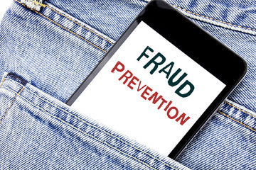 Handwriting Announcement text showing Fraud Prevention. Business concept for Crime Protection Written phone mobile phone, cellphone placed in man front jeans pocket.