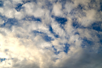 Large white cumulus clouds on a blue sky for background or ecology or nature.